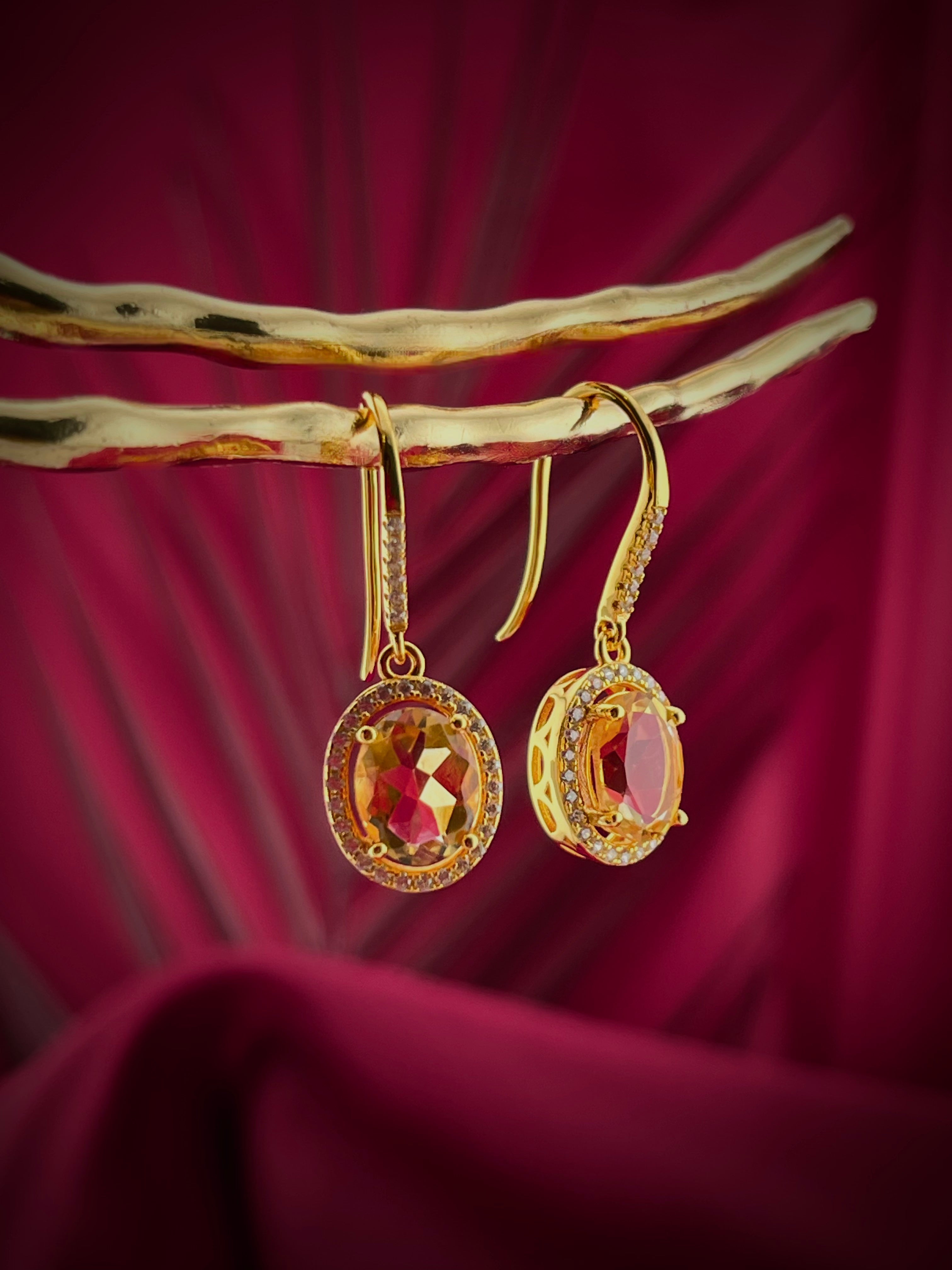 Haspiera citrine yellow hook earrings featuring oval gemstone and intricate gold detailing
