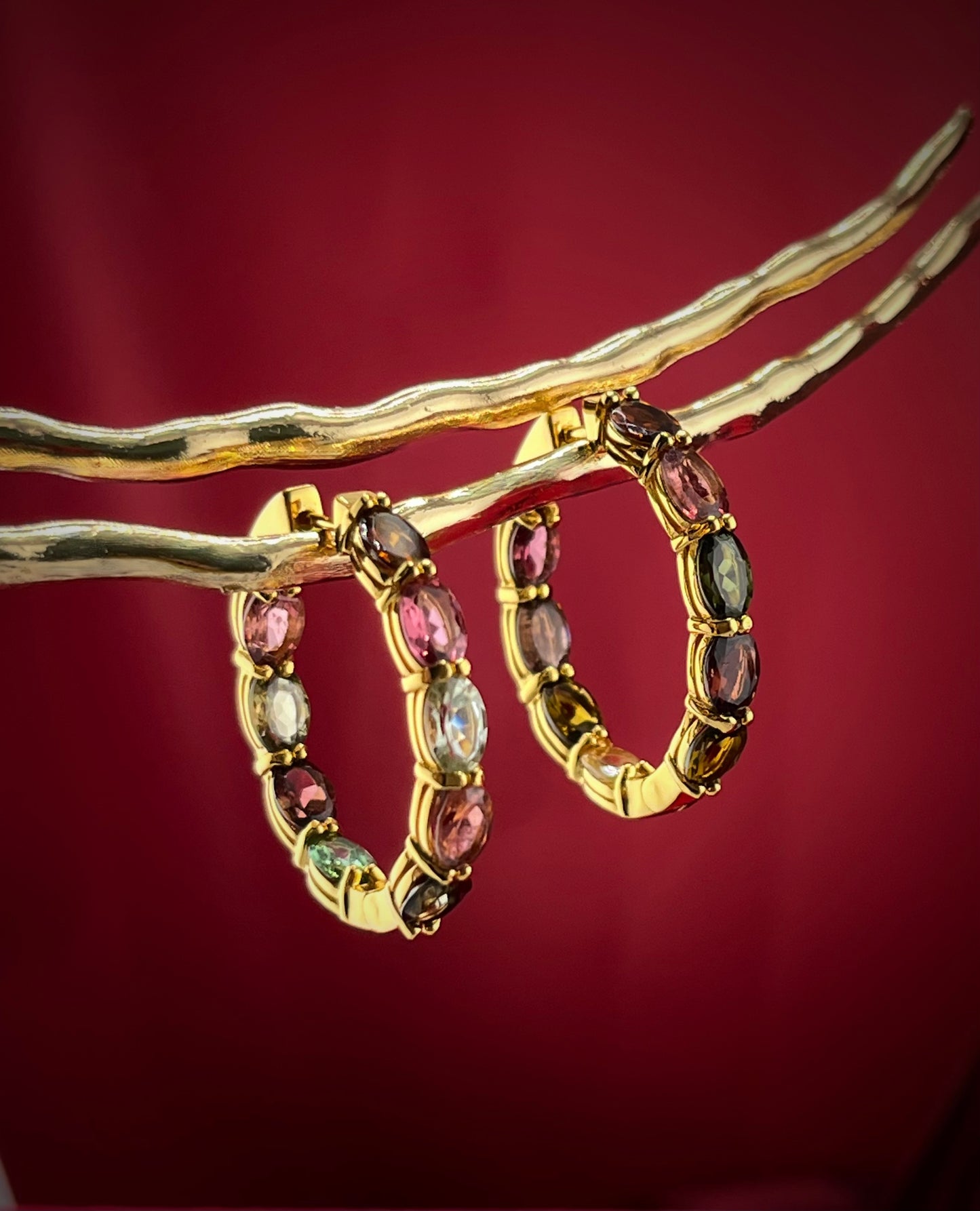 Haspiera multicolor gemstone hoop earrings featuring oval stones set in gold hoops