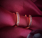 Haspiera gemstone gold hoop earrings featuring minimalist everyday earrings design on burgundy fabric