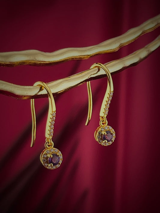 Haspiera gold violet drop earrings with gemstone and small diamonds on elegant display