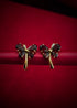 Haspiera red butterfly earrings with gemstone petals and gold-tone stems on red background