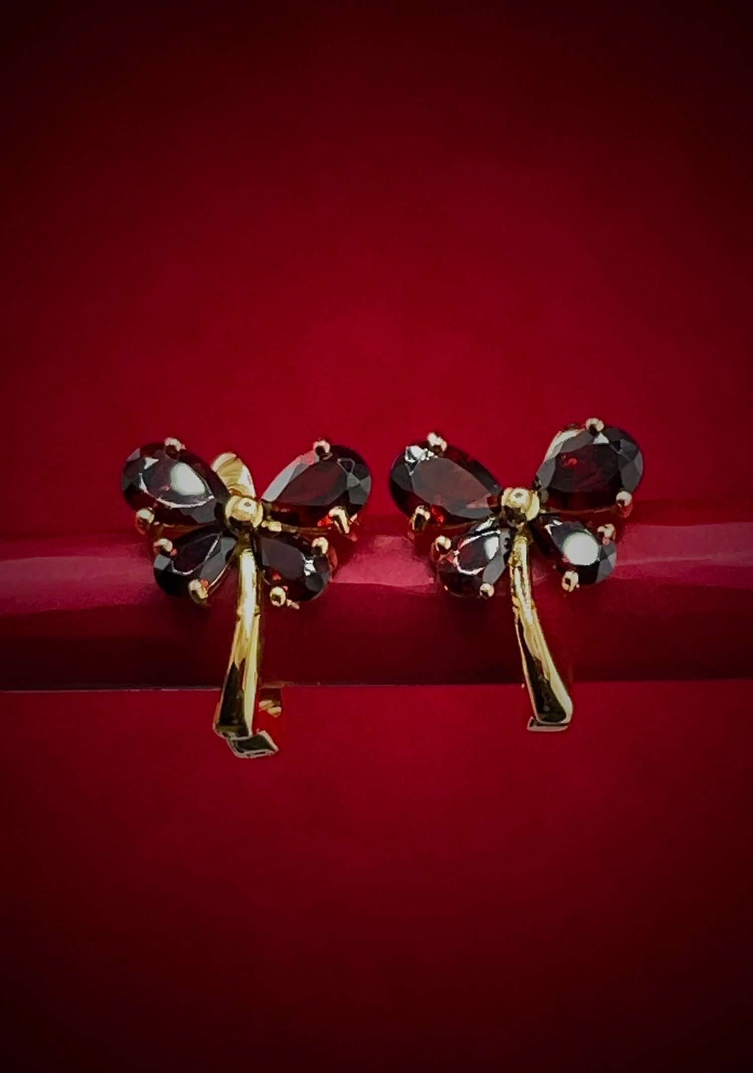 Haspiera red butterfly earrings with deep red gemstones and gold-tone metal setting