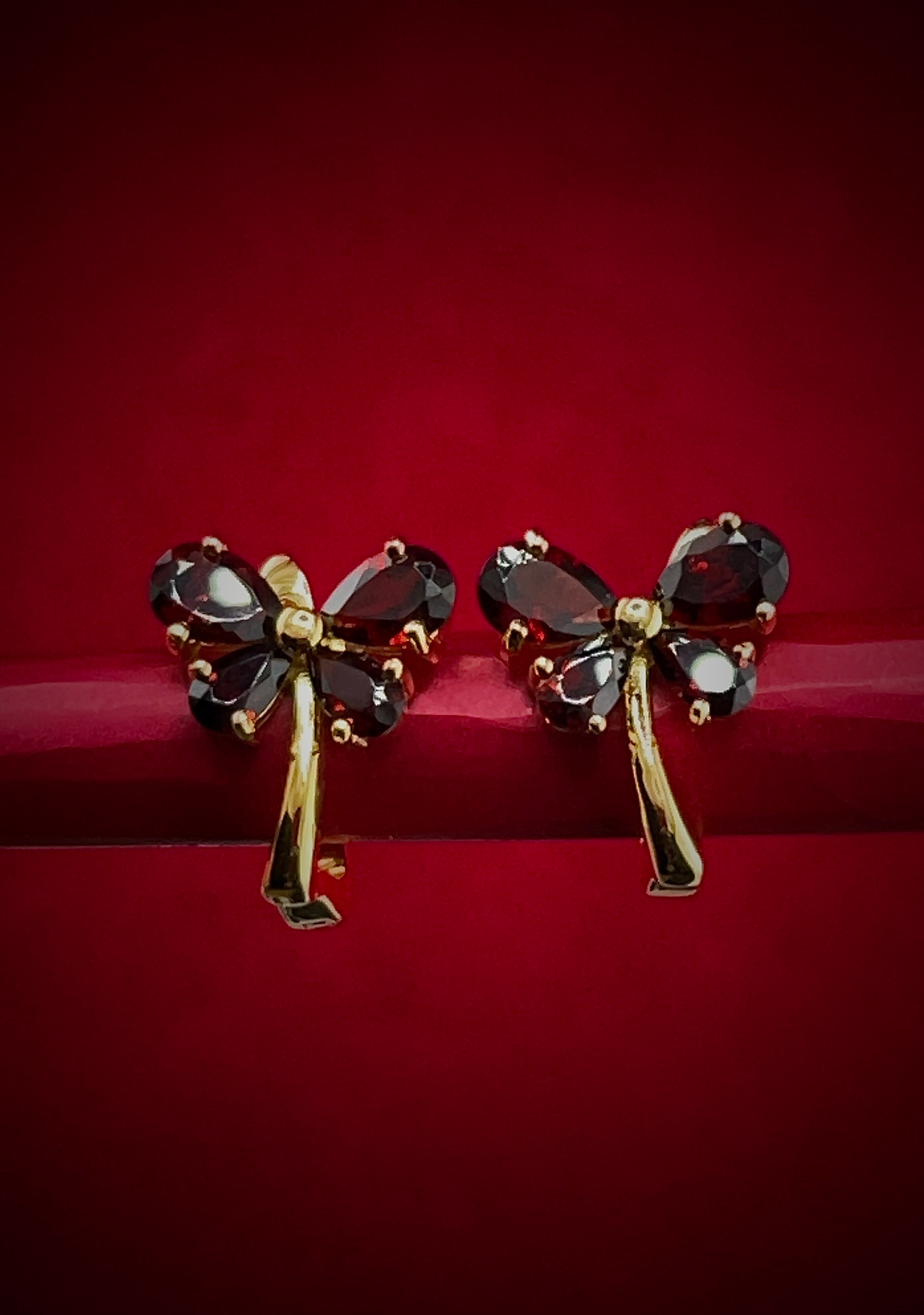 Haspiera red butterfly earrings with deep red gemstones and gold-tone metal setting